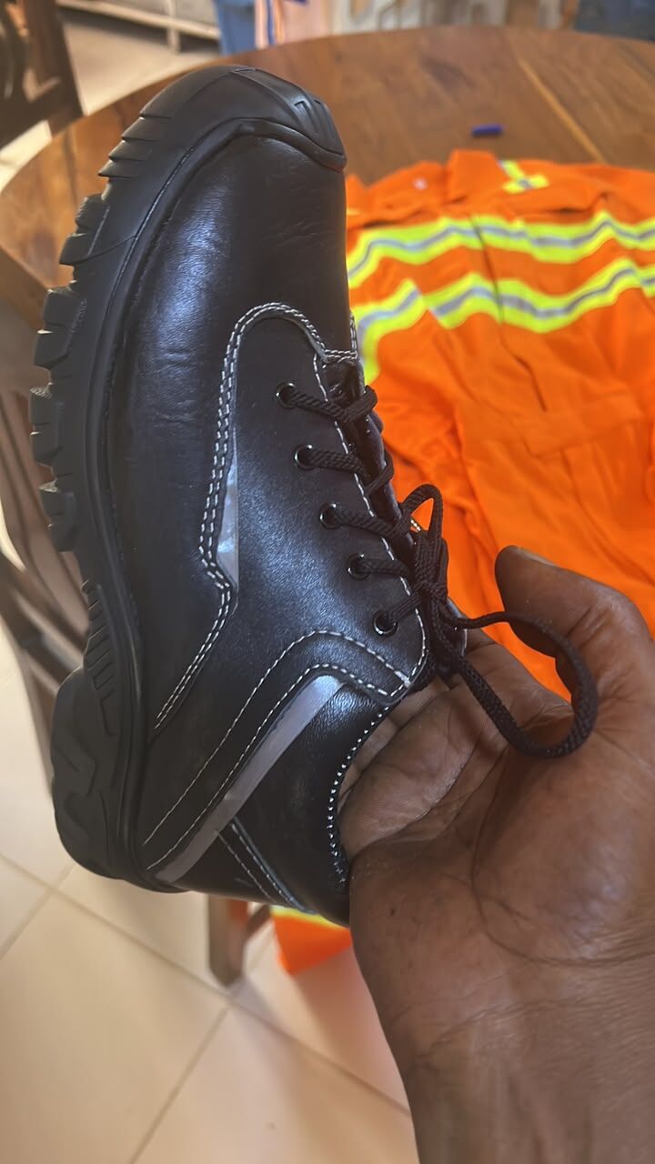 Black lace-up boot showing contrast stitching